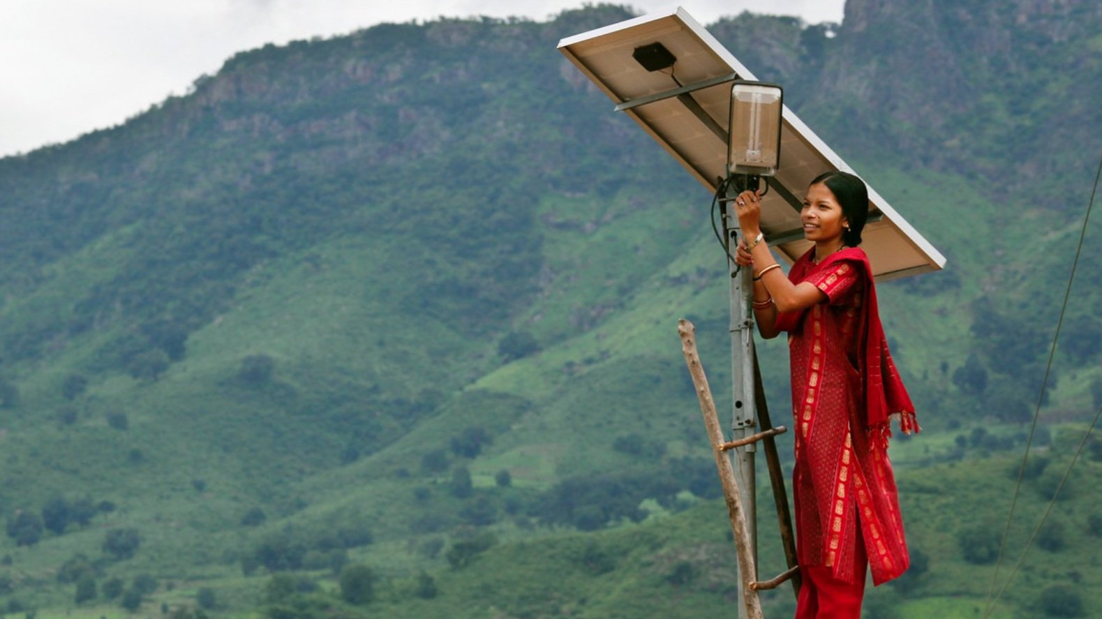 Woman fixing solar panels