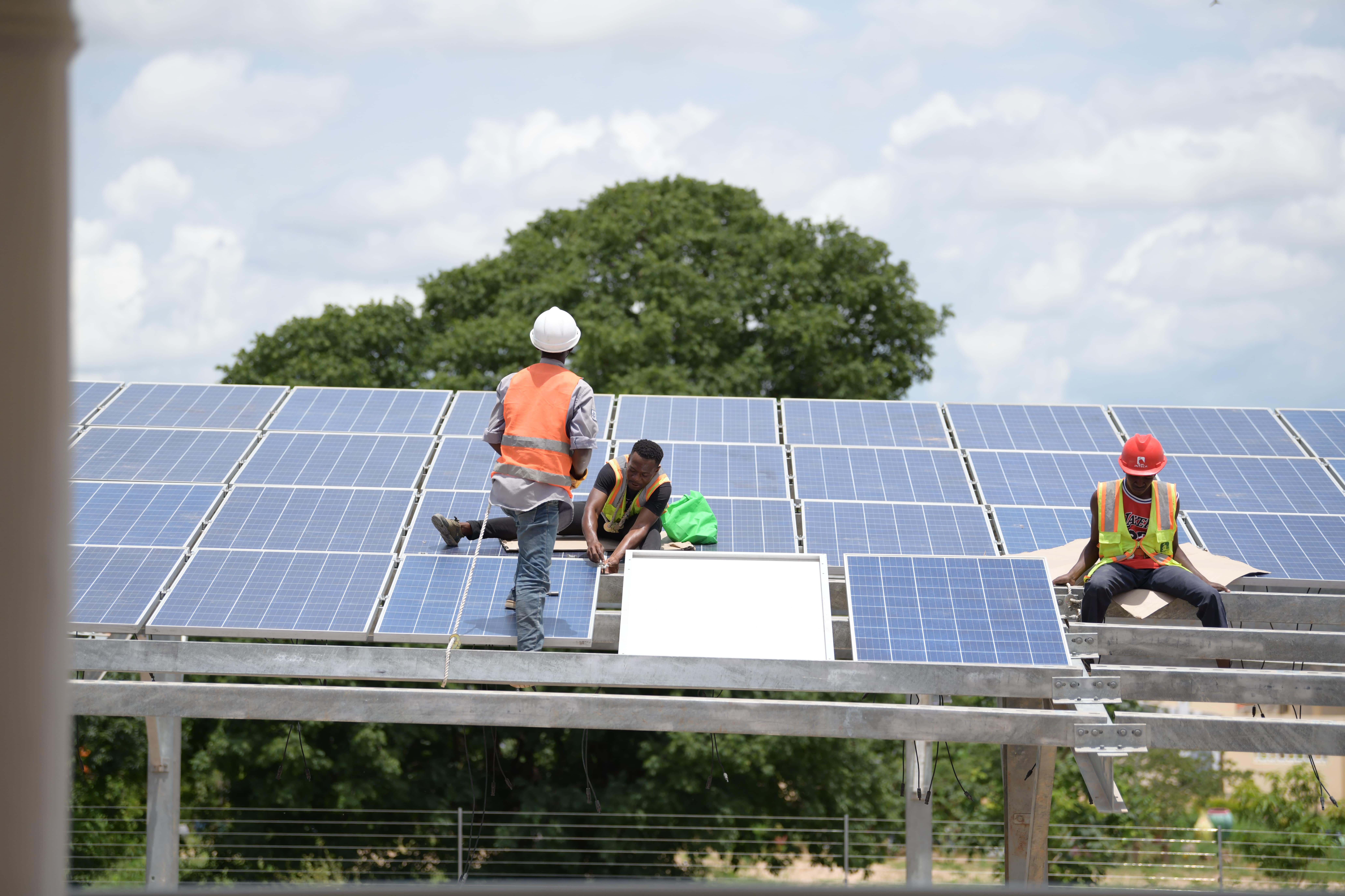 Engineers install solar panels