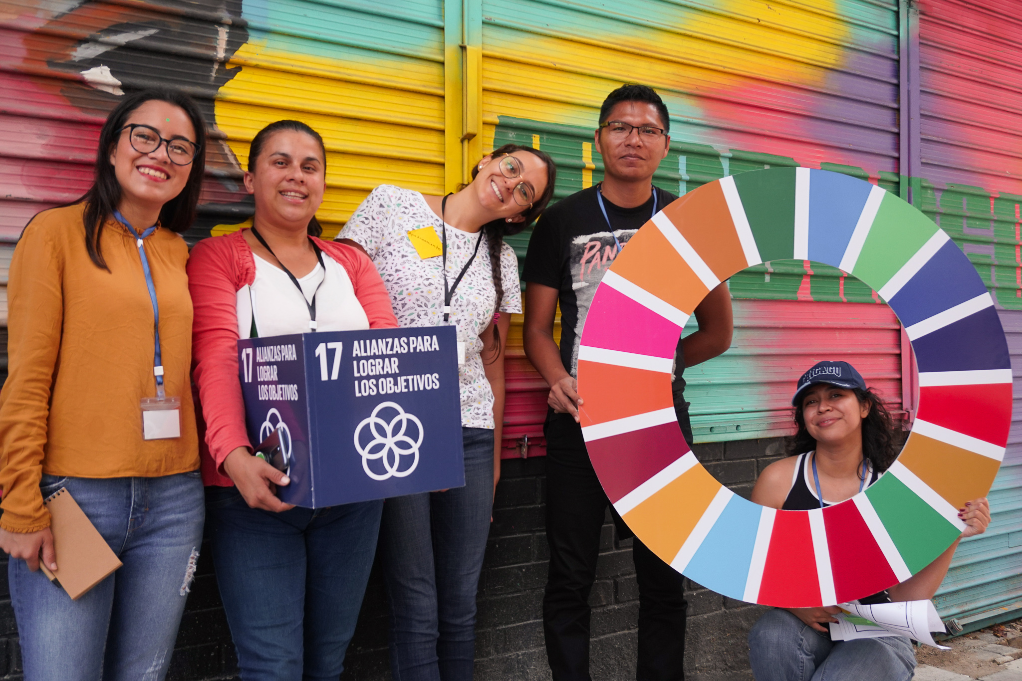 people holding SDG signs
