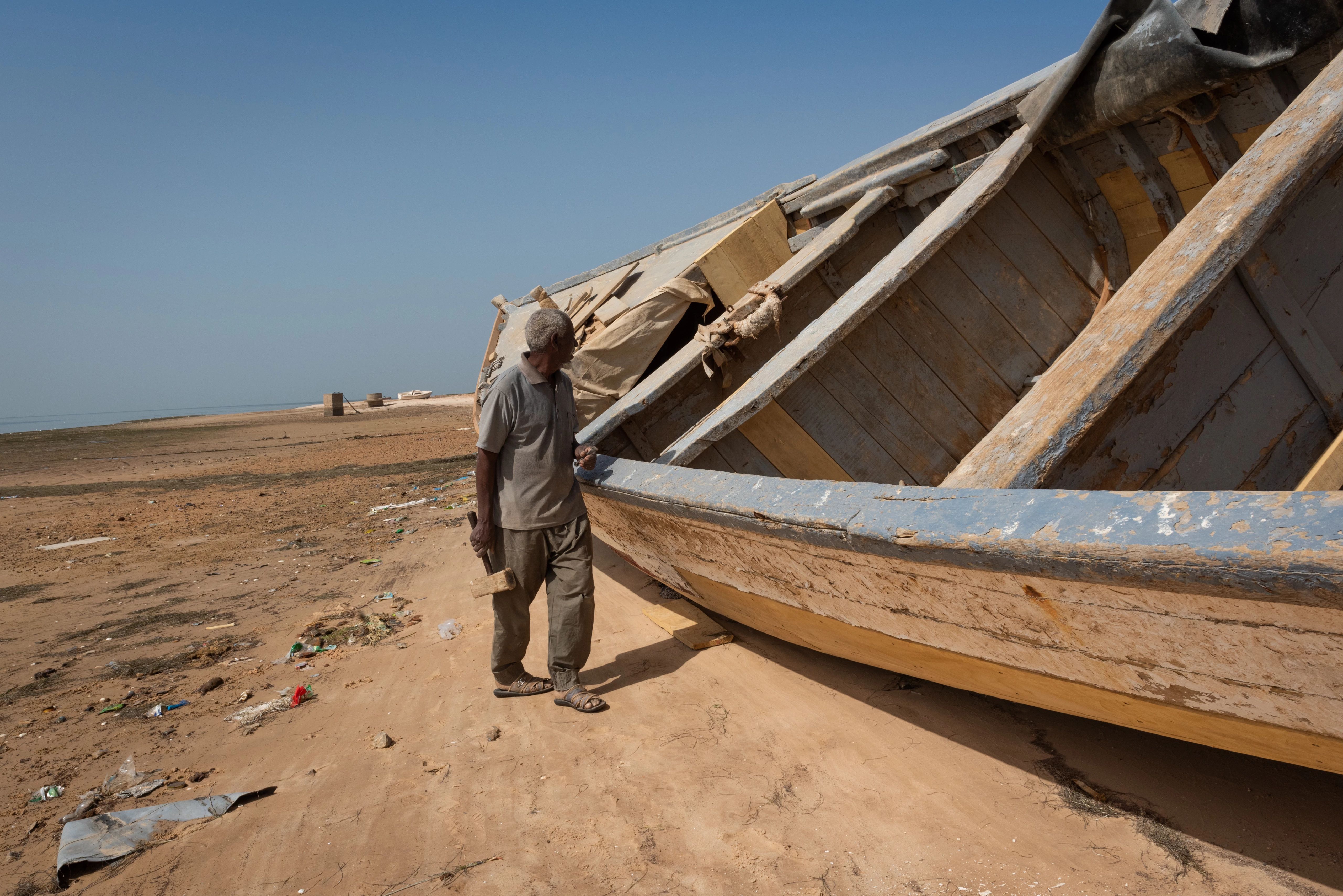 Drought, fisherman and a boat