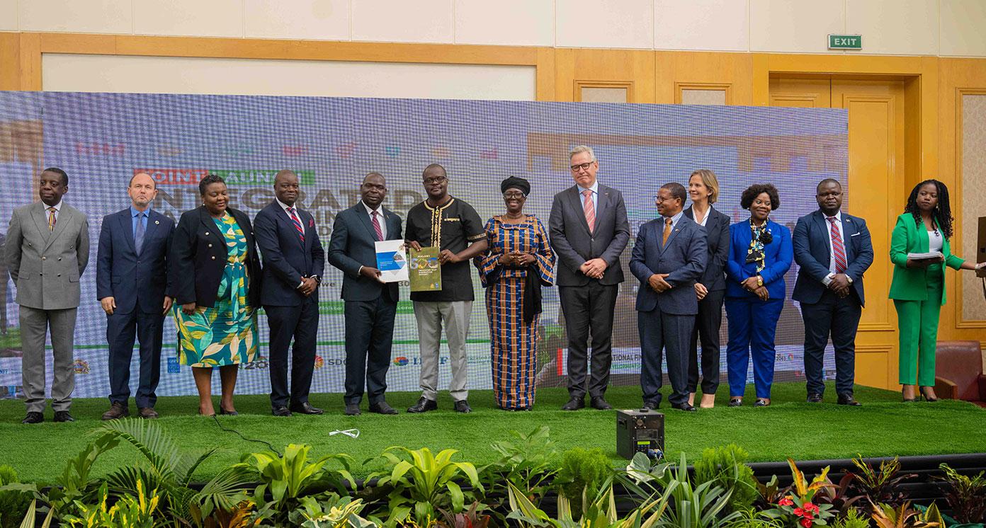 Peope standing next to one another